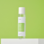 IUNIK Tea Tree Relief Toner (200ml) on green background